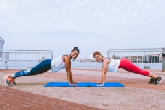 Two women doing high plank